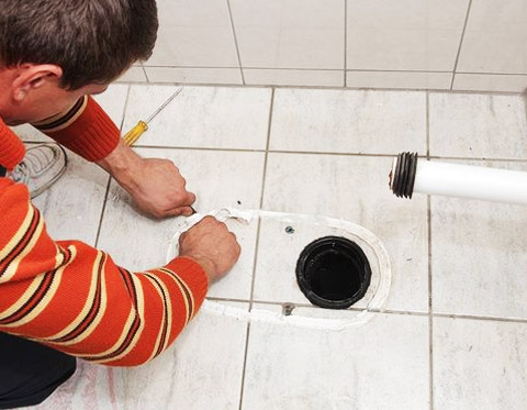 An image of a toilet being removed